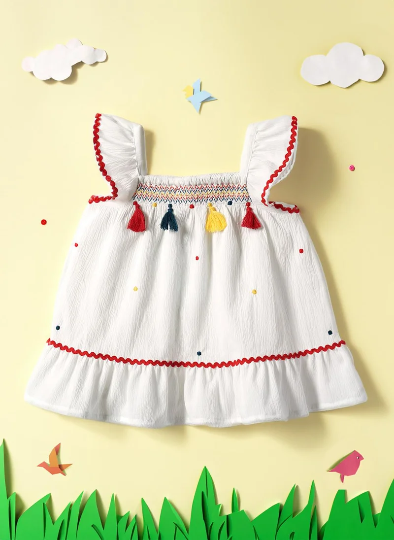 Girls' A-line Polka Dot Embroidered Dress with Multicolour Tassels & Smocked Neck